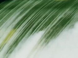 Dramatic slow motion water falling over dam spillway Stock Footage