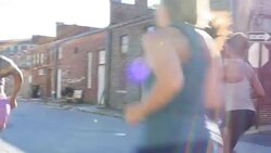 MS Group of women running on urban street at sunrise Stock Footage