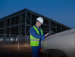 Engineer or job superintendent uses a tablet on construction site Stock Footage