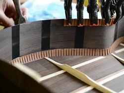 Craftsman 'Luthier' Nigel Forster making hand made Guitars Stock Footage