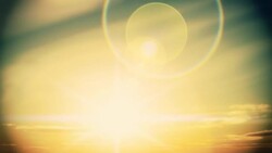 A rising sun brightens amid beautiful coronas. Stock Footage