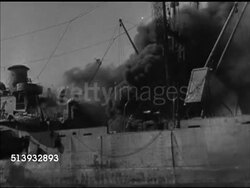 1943: ALLIED INVASION: VS Smoking & damaged ships near shore, transport ships partially submerged, others listing, submerged.  World War II, WWII, amphibious assault, scrap metal, battle damage. Instructional Video