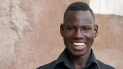 Attractive black african man smiling at camera Stock Footage