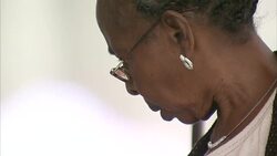 Tourists browsing Papal souveniers at The Vatican News Clip