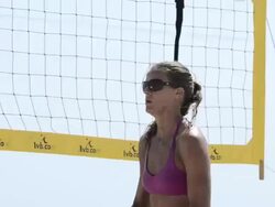 CU of a female beach volleyball player hand setting the ball. Stock Footage