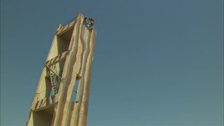 A soldier rappels down a tall tower during a training exercise in Saudi Arabia. Stock Footage