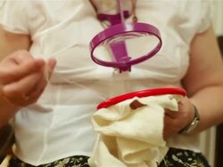 Hands working on a knitting project Stock Footage