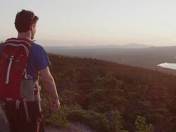 MS PAN Shot of Two men hikiing top of mountain peak in 100 Mile Wilderness of Northern / Maine, United States Stock Footage