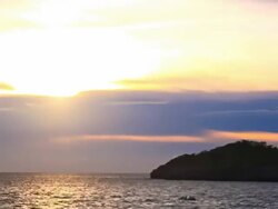 Timelapse-sunset and island.(panning) Stock Footage