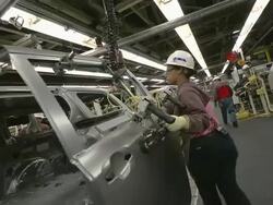 MS PAN Woman installing side door on minivan in an auto assembly plant / Princeton, Indiana, United States Stock Footage