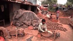 Indian craftsmen making clay pottery and Diyas for Diwali News Clip
