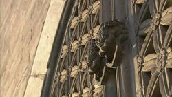 Ornate door knockers decorate a bell tower in Beijing. Stock Footage