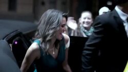 Hollywood couple climb out of limousine and pose for cameras at red carpet premiere at awards show Stock Footage