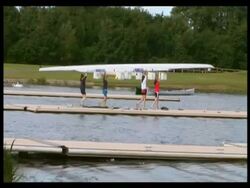 Getting boats ready and putting on water, Eton College Rowing Club, Dorney Lake, UK. 2007; short sequence. Stock Footage