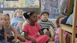 Listening to the Preschool Teacher Read Stock Footage