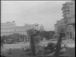 B/W 1962 tilt down soldiers adjusting gun on city street / Cuba / Cuban Missile Crisis / newsreel Stock Footage