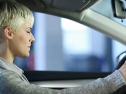 Mechanic handing over a car key to a young woman Stock Footage