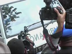 Supporters and police push and shove as coffins are carried through Lamongan News Clip