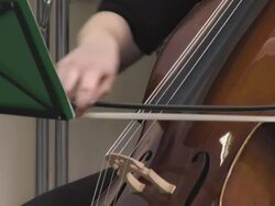 HD: Teenage Girl Playing Cello In Music Class Stock Footage