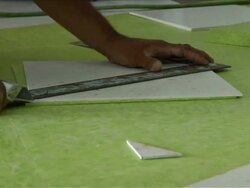 Construction Worker Lays Vinyl Tile Flooring Stock Footage