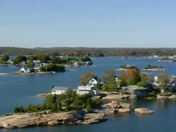 WS AERIAL ZI ZO View of houses surrounded by tree at Thimble Islands / Connecticut, United States Stock Footage