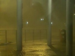 Pan across sea wall to car park hurricane winds, Typhoon Koppu, Hong Kong on night of 14th sept 2009. With Audio. Stock Footage