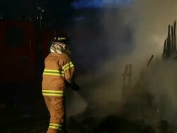 MS Shot of fire brigade man fire extinguishing / Seoul, South Korea Stock Footage