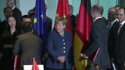 CLEAN : Merkel pledges to avert EU China trade war News Clip