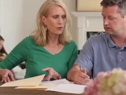 Parents Discuss Home Finances with Kids in Background Stock Footage