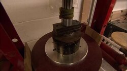 A technician operates a lever to adjust the mechanism of a roulette wheel. Stock Footage