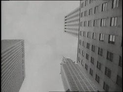 Women's legs walk along the sidewalk on a sidewalk in Midtown Manhattan near the Chrysler Building. News Clip