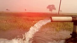 watering in the field during winter season Stock Footage