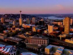 Aerial view of downtown Seattle at dusk / circling the Space Needle / Seattle, Washington Stock Footage