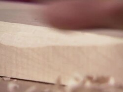 MS ZI Carpenter chiseling piece of wood/ Slovenia Stock Footage