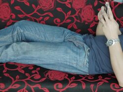 Asian male relax on sofa with smartphone Stock Footage