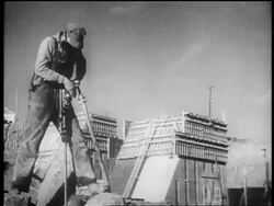 B/W 1930s male worker using tool in dam construction / Tennessee River Valley Stock Footage