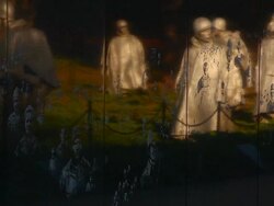 Panning shot of the Korean War Veterans Memorial wall in Washington DC Stock Footage