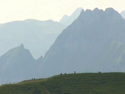  WS Shot of tourist enjoying at Mount Nebelhorn in front of HÃƒÂ¶fats / Oberstdorf, Bavaria, Germany Stock Footage