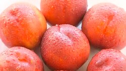 Ripe peaches on the white plate Stock Footage