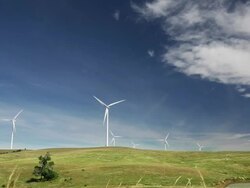 Wide angle view of a windmill farm Stock Footage