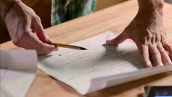 Creative team in wood shop take notes on graph paper Stock Footage