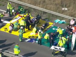Aerials triage and paramedic on bridge News Clip
