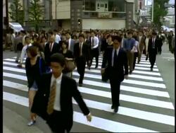 MS Crowds of office workers crossing pedestrian crossing, to camera, Morning rush hour, Tokyo, Japan Stock Footage