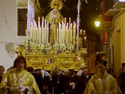 CU POV  Statue of  Virgin Mary being carried through streets on  canopied throne surrounded by candles  / Archdona, Andalusia, Spain  Stock Footage