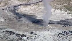 Gathering To Watch Old Faithful Blow  - Aerial View - Wyoming,  Teton County,  helicopter filming,  aerial video,  cineflex,  establishing shot,  United States Stock Footage