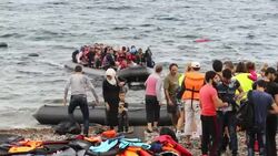 Syrian migrants fleeing the war and escaping to Europe, landing on the Greek island of Lesvos on the north coast at Efthalou. Up to 4,000 migrants a day are landing on the island and overwhelming the authorities. They are traficked by illegal Turkish peopl Stock Footage