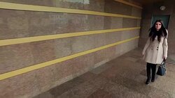 Stylish young woman walking on tiled floor Stock Footage