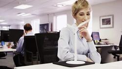 Businesswoman contemplating wind turbine model Stock Footage