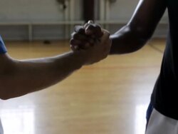 MS Two men shaking hands before palying basketba against each-other inside gymnasium / Minneapolis, Minnesota, United States  Stock Footage