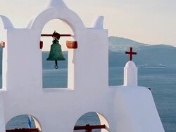 CU ZO Shot of church bells at village Oia with Ocean / Santorini, Cyclades, Greece Stock Footage